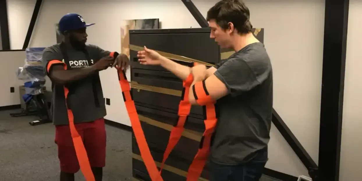 Professional movers carrying boxes